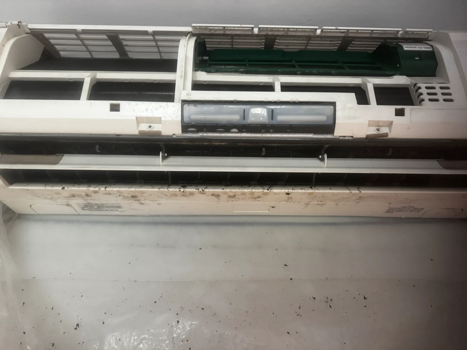 Mini-split indoor unit with front cover off mid-service during a Brooklyn deep clean