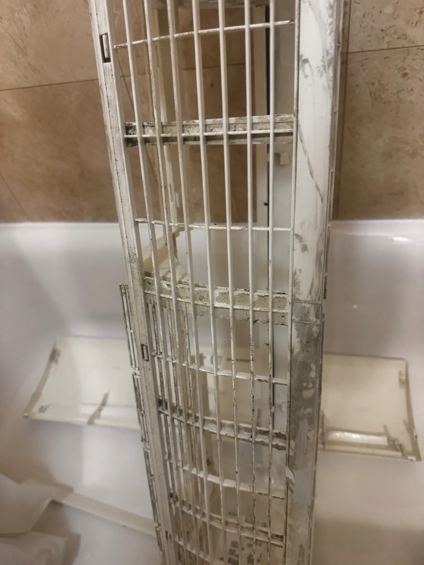 Dirty mini-split intake grille and fins before deep cleaning