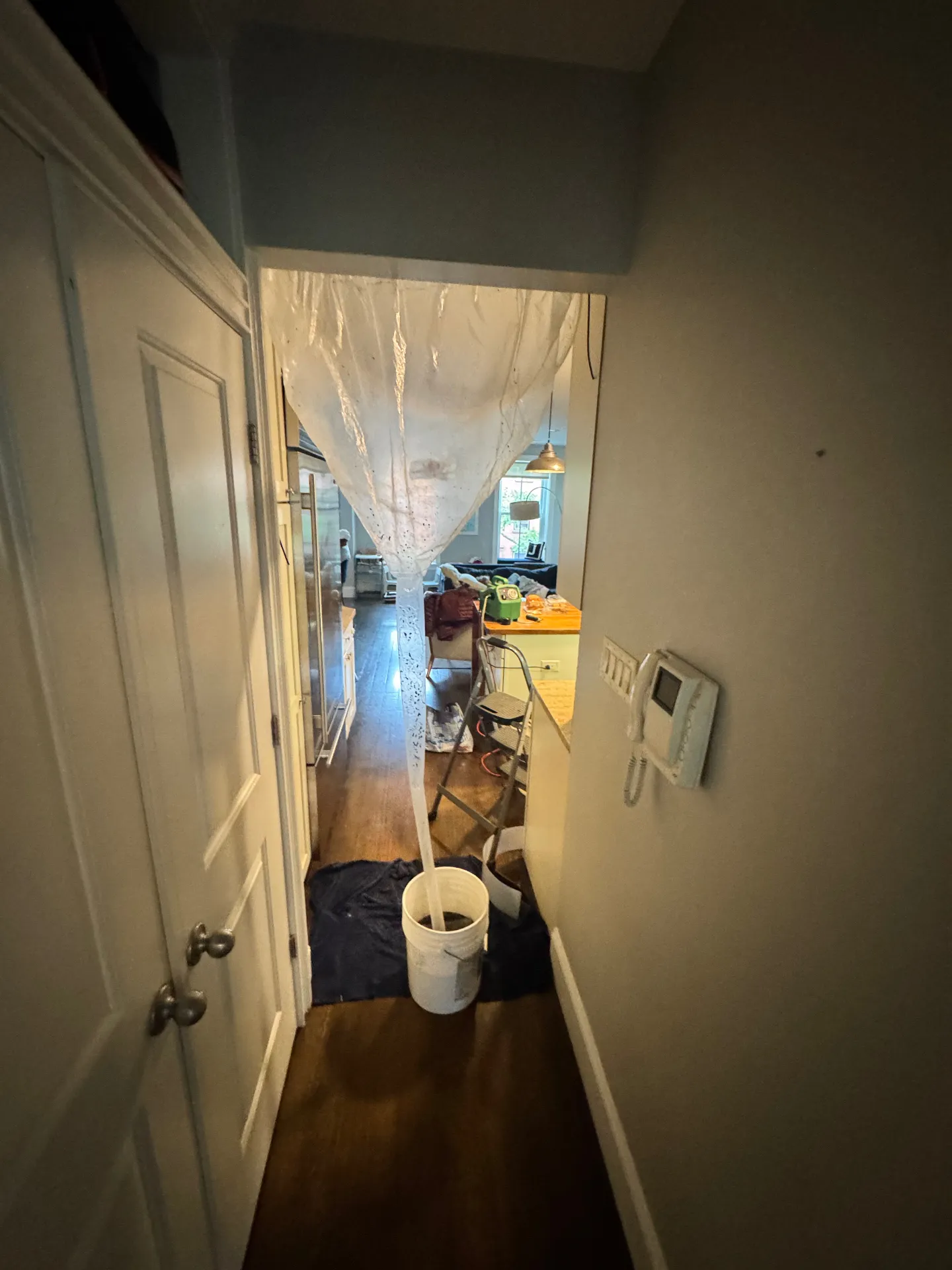 SpeedClean containment bib system protecting the wall and floor during a Brooklyn mini-split deep clean