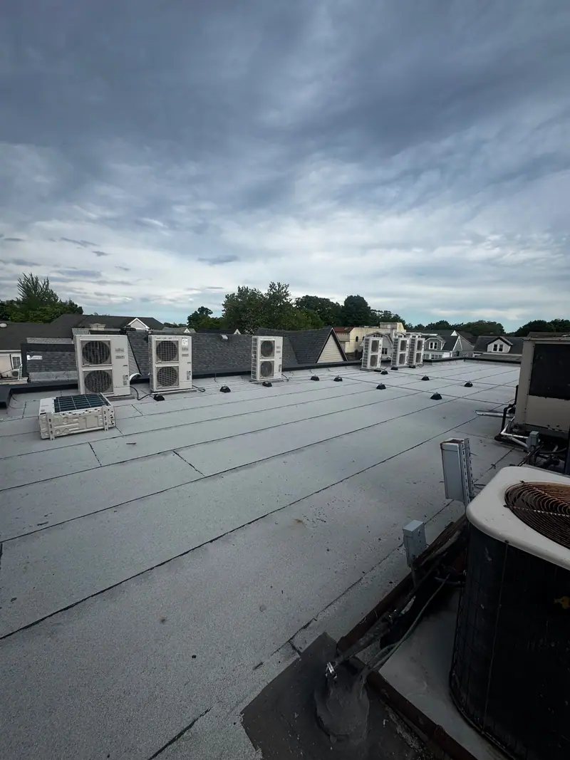 Row of Fujitsu multi-zone condensers on a flat Brooklyn roof