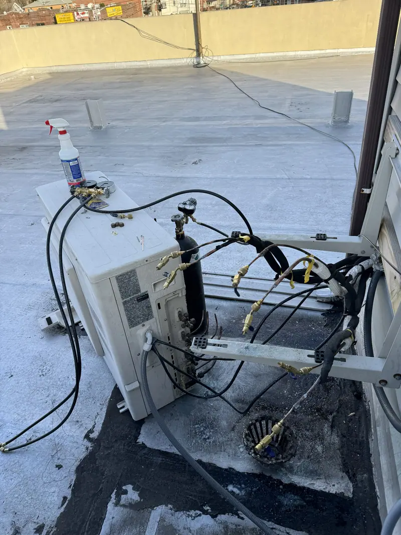 Brooklyn rooftop nitrogen pressure test on a mini split condenser