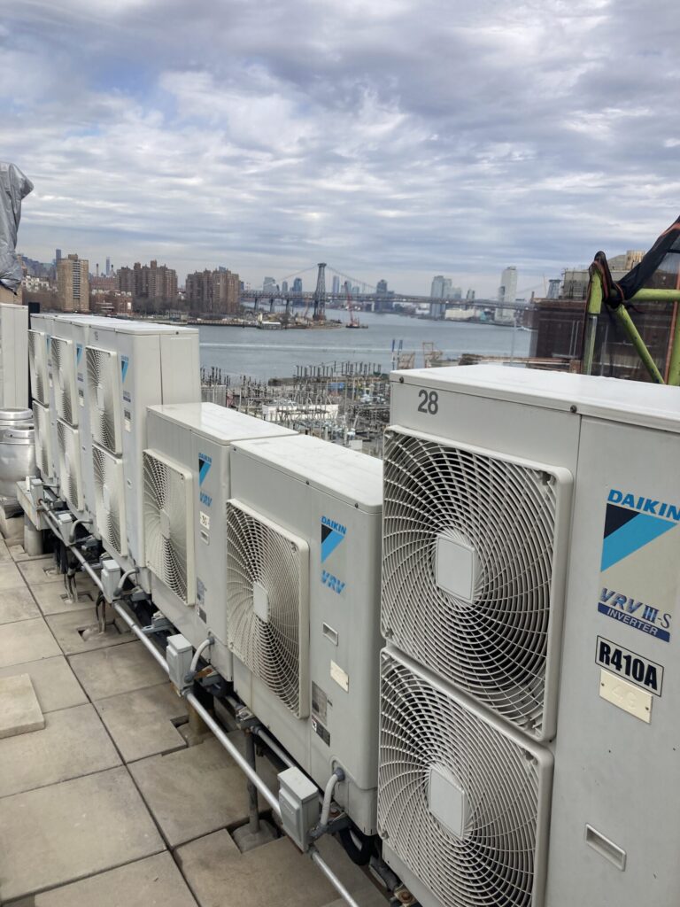 Multiple AC condenser units installed on Brooklyn rooftop HVAC system